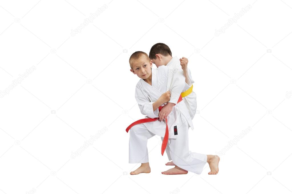 In karategi athletes are training grip for throw