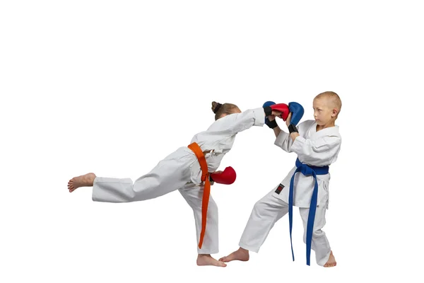 Children with overlays on his hands are training blow gyaku-tsuki — Stock Photo, Image