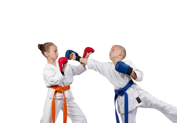 Young athletes with overlays on hands are training  karate blows — Stock Photo, Image