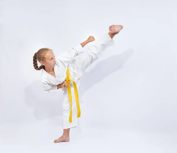 Yoko geri kick in the performance of small sportswoman — Stock Photo, Image