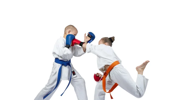 Paired exercises karate kids are training with overlays on his hands — Stock Photo, Image