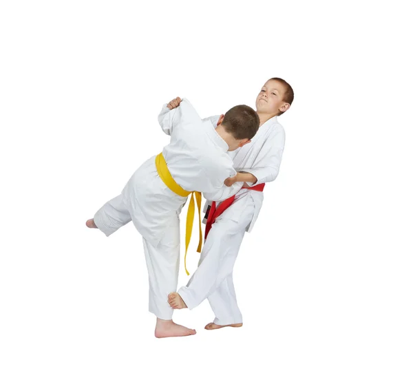 Slicing down under leg are training athletes in judogi — Stock Photo, Image