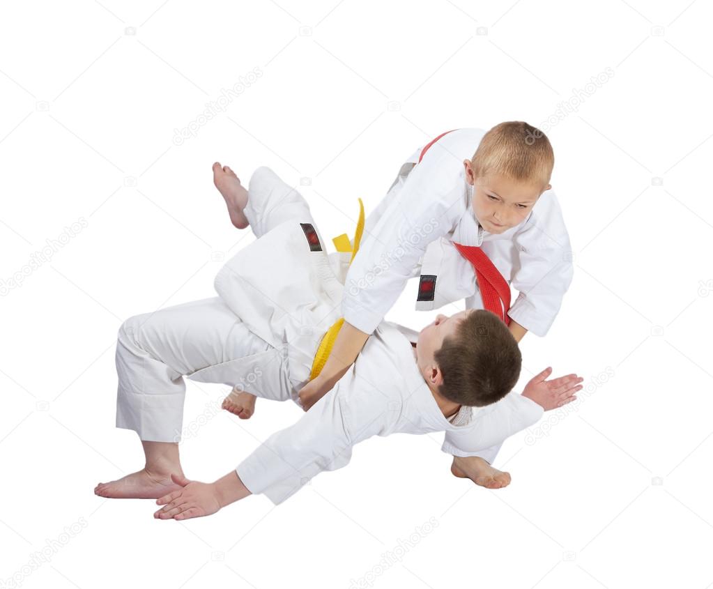 Active athletes are doing judo throws