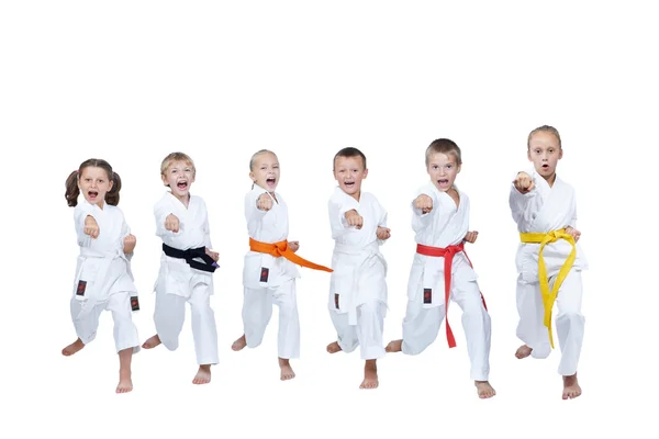 Six young athletes are beating the blow gyaku Tsuki — Stock Photo, Image