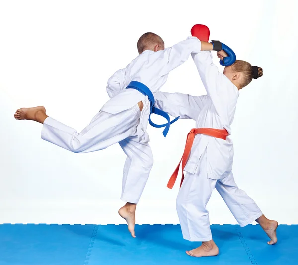 Blow in jump in perfoming an athlete with a blue belt — Stock Photo, Image