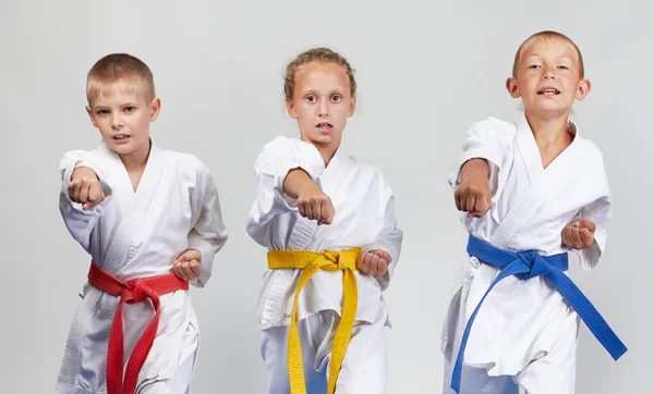 Gyaku-tsuki are beating sportsmens in karategi — Stock Photo, Image