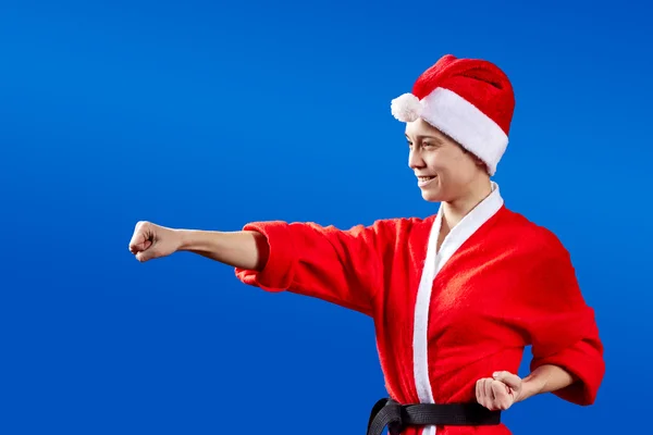 Girl with a black belt beats punch — Stock Photo, Image