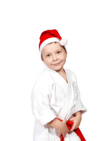 Söt liten pojke i en kimono och bär Santa hatt — Stockfoto