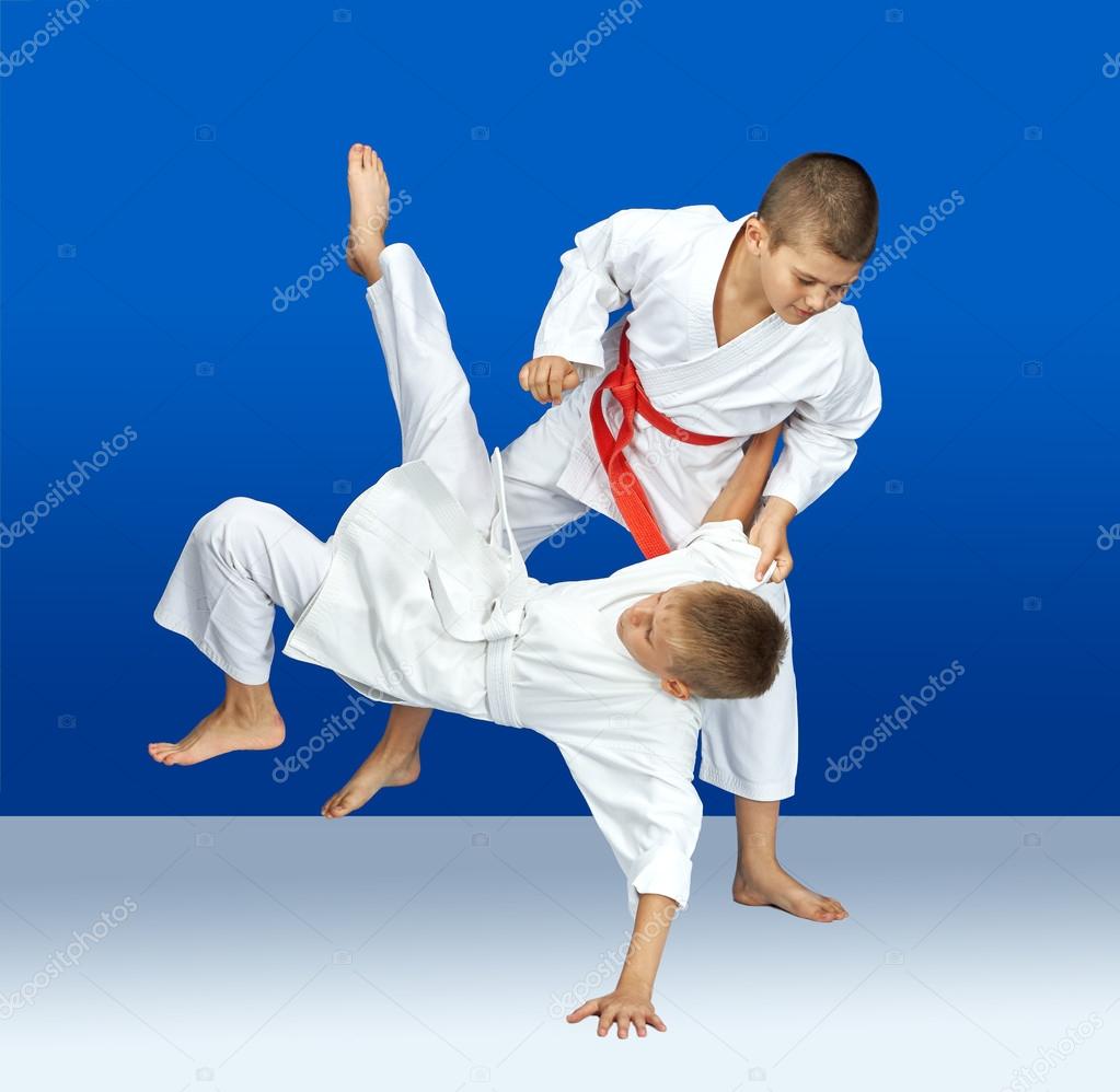 Two sportsmens are training judo throws