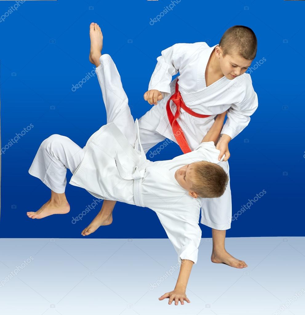 Sportsmens are training judo throws