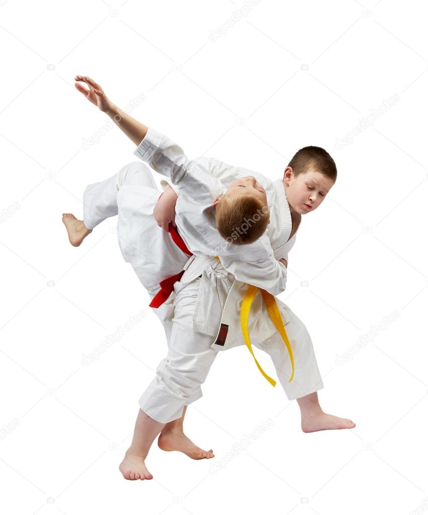 In judogi sportsmen are training throws