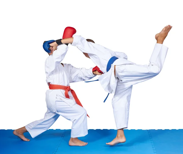 Two children in karategi are training karate blows — Stock Photo, Image