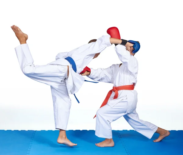 A boy with a blue belt beats punch in jump — Stock Photo, Image