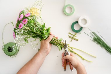 Man arranging flowers