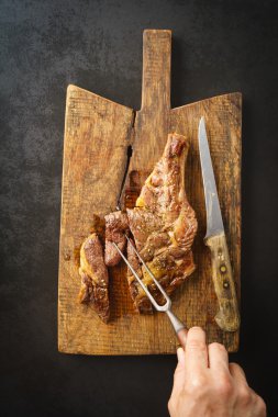 Steak on wooden board clipart