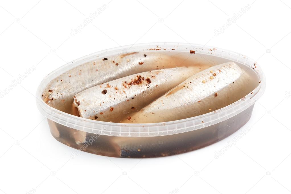Salted herrings in a plastic pot 