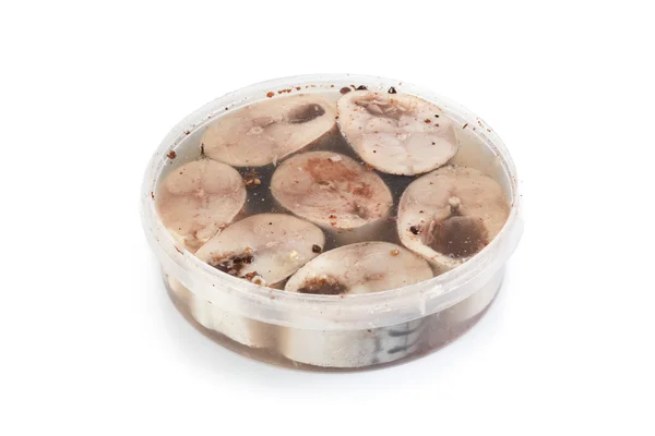 Salted herrings in a plastic pot — Stock Photo, Image