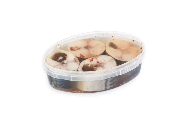 Salted herrings in a plastic pot — Stock Photo, Image