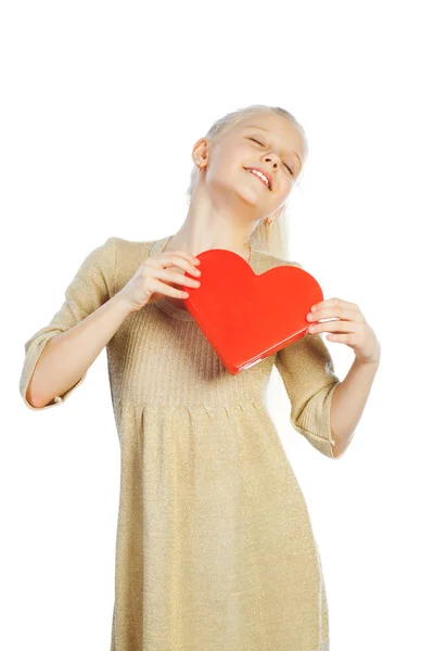Beautiful girl holding heart in arms. — Stock Photo, Image