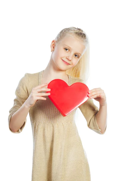 Beautiful girl holding heart in arms. — Stock Photo, Image