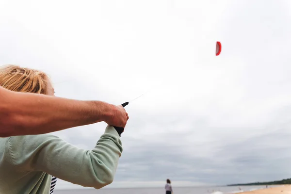 Coach teaches girl control the kite