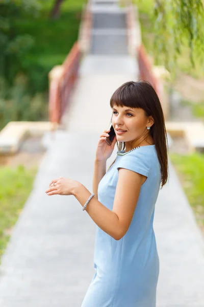 Happy beautiful girl calling by phone — Stock Photo, Image