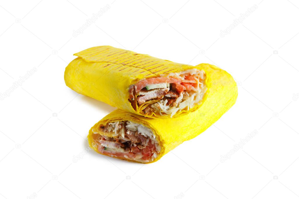 Two crossed pars of Greek cheesy shawarma with layers of chicken meat, cucumber, cabbage, cheese served on plate, isolated on white background. Turkish donner wrapped in yellow lavash bread. Arabic street food. Gyros (fajitas, pita bread, shawarma)