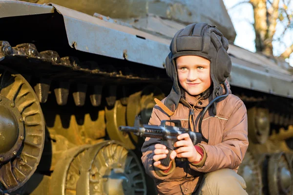 Portrait of young boy with gun — Stock Photo, Image