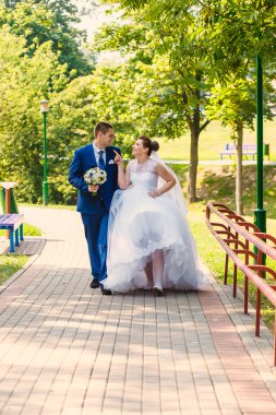 bride and groom is walking together