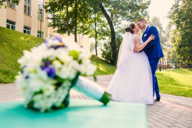 bride and groom is dancing together 