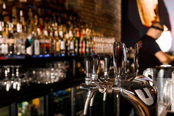 Young man working as a bartender — Stock Photo, Image