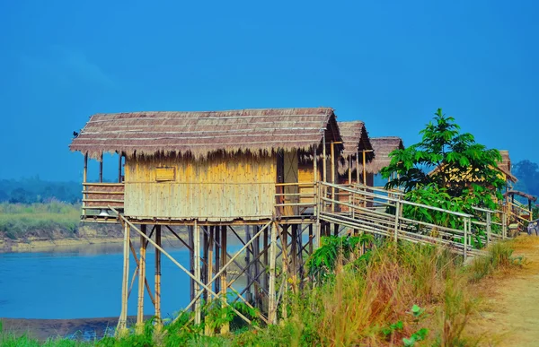 Wooden houses built on high stilts called in Chitwan, Nepal — Stock Image Wooden houses built on high stilts called in Chitwan, Nepal Stock Picture