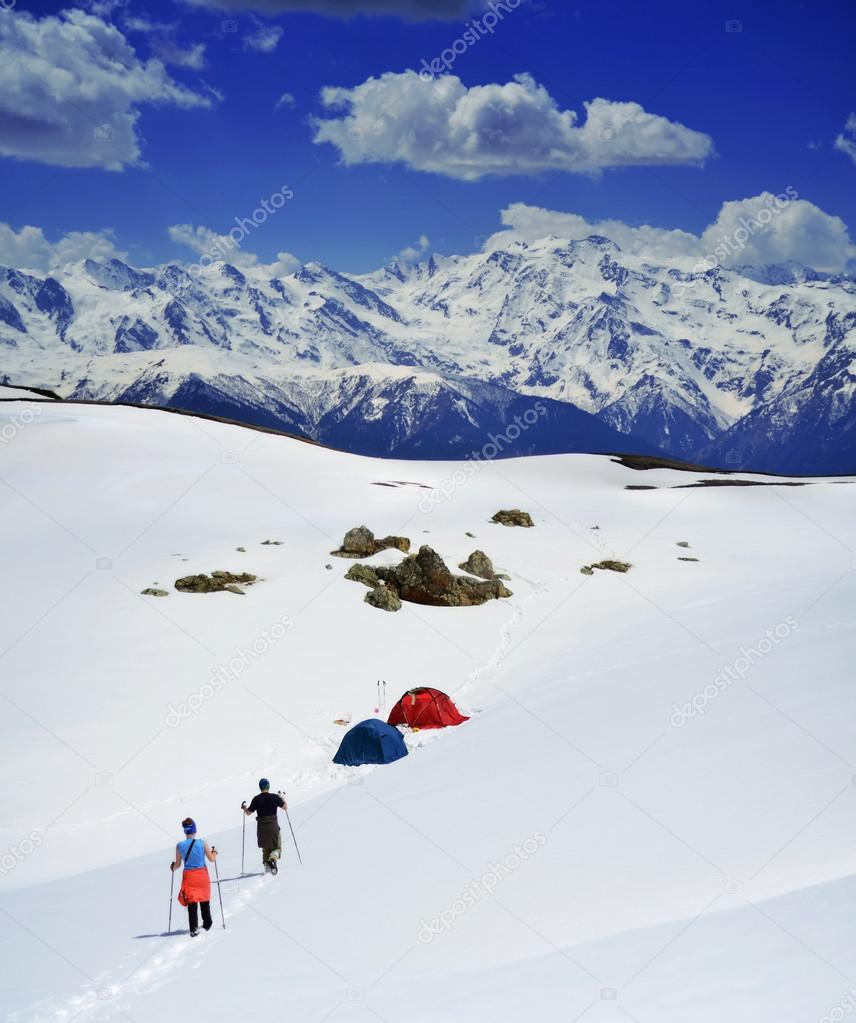 People hiking  on snow , Svaneti landscape in Georgia