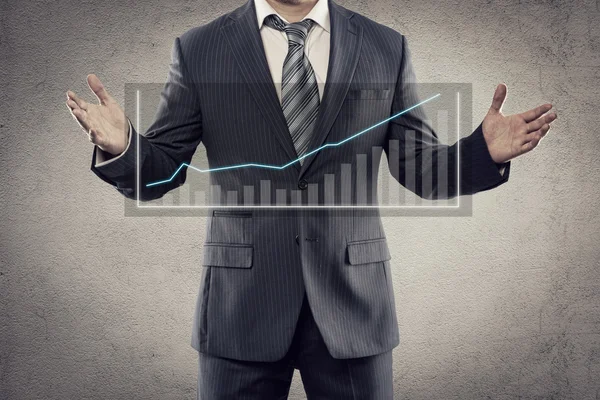 Businessman showing graph