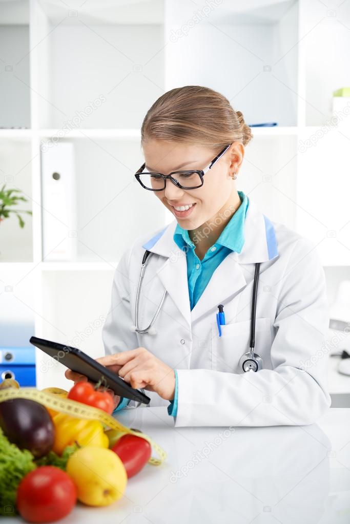 Doctor dietitian with tablet pc