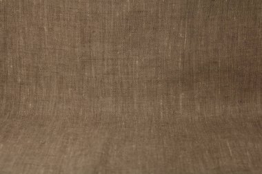 Pürüzsüz bir yüzeyi ve ışıltısı olan boyanmamış kumaş.