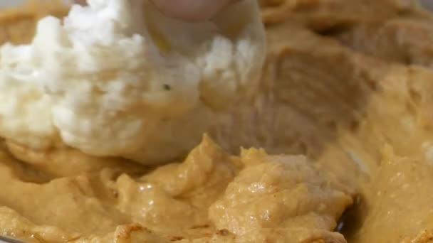 Dipping Cauliflower Floret Dish Fresh Hummus Slow Motion — Stock Video