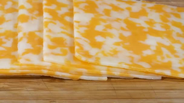 Slices Organic Colby Cheese Cutting Board Slider Shot — Stock Video