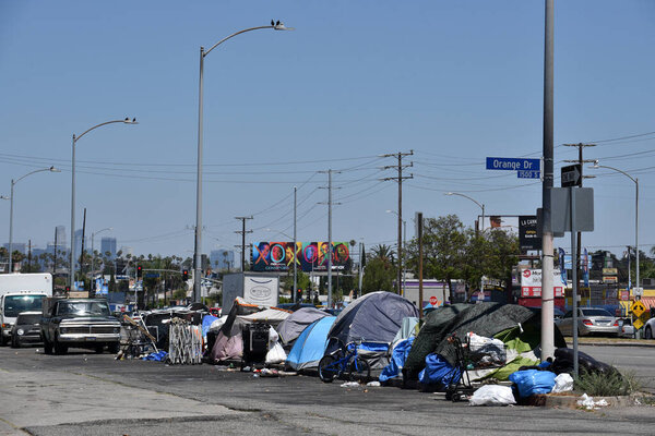 Los Angeles, CA USA - June 30, 2021: Homeless encampment on a traffic island on the west end of Los Angeles near LaBrea