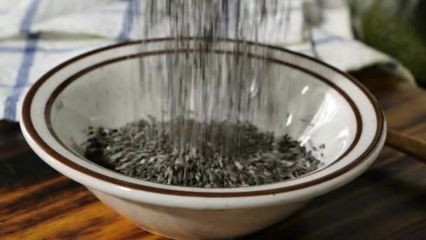 Pouring Black Chia Seeds Bowl Super Slow Motion — Stock Video