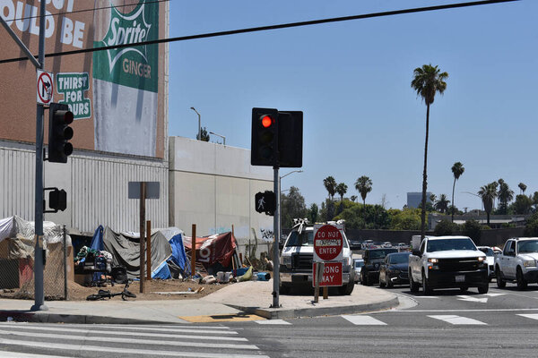 Hollywood, CA USA - July 1, 2021: Homeless encampment alongside a freeway off ramp