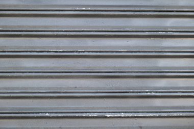 Grunge çelik yuvarlanan kapı arkaplanı kapat