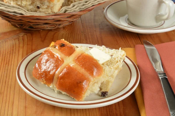 Buttered hot cross bun — Stock Photo, Image