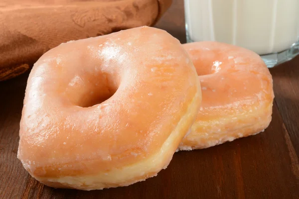 Glazed donuts and milk — Stock Photo, Image