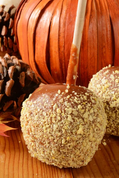 Caramel apple with nuts — Stock Photo, Image