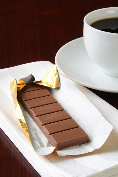 Milk chocolate with a cup of coffee — Stock Photo, Image