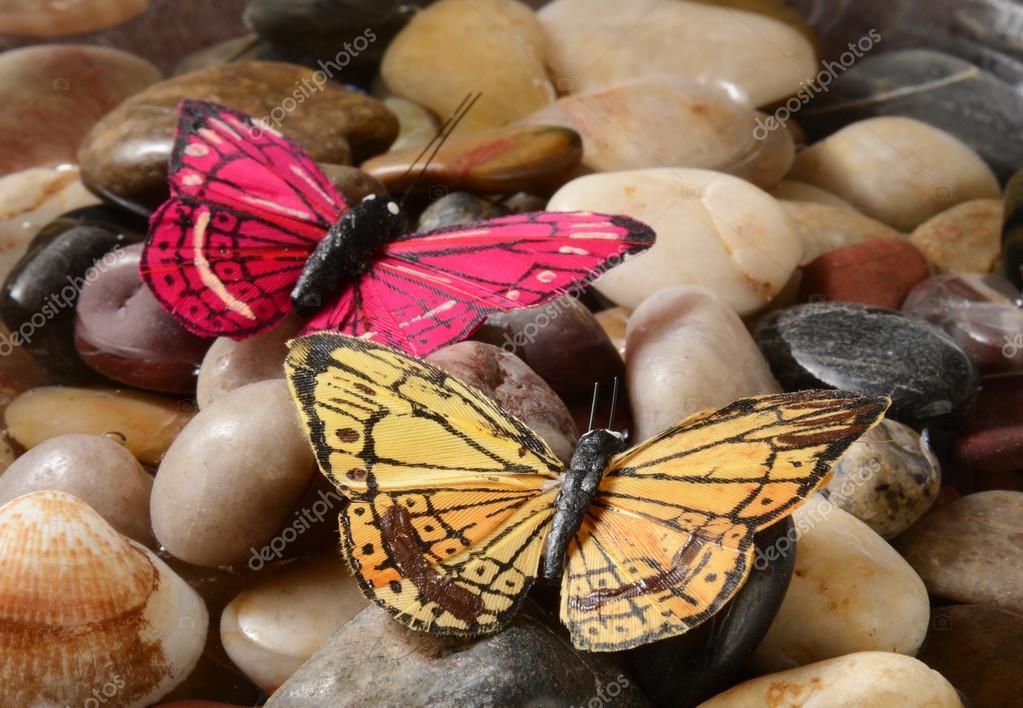 Butterfly Decorations On Pebbles Stock Photo C Msphotographic