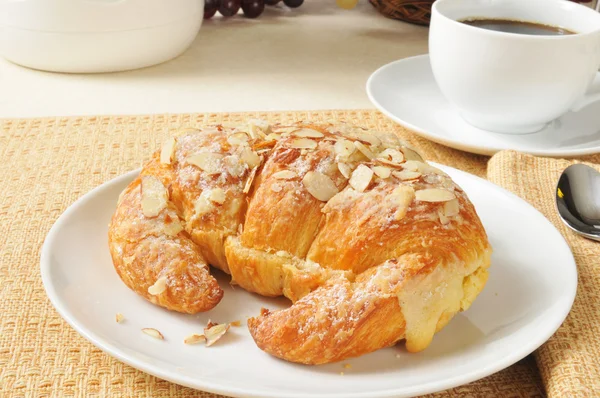 Custard filled almond croissant — Stock Photo, Image