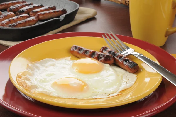 Sausage and fried eggs — Stock Photo, Image