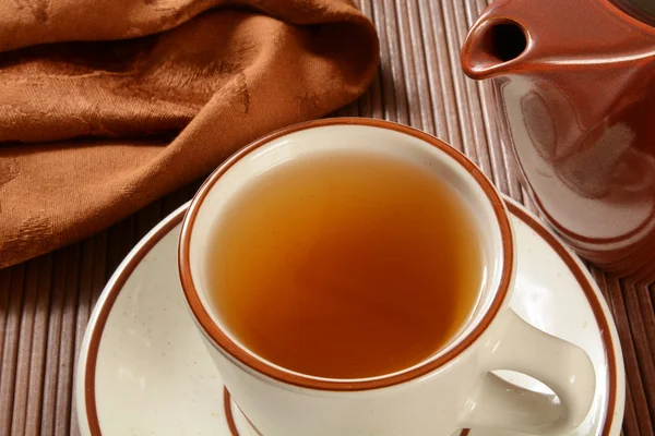 Cup of tea with pot — Stock Photo, Image